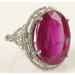 Lady's 18.41 Karat Oval Brilliant Cut Ruby and 14 Karat White Gold Ring accented with small Round