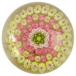 Baccarat Glass Paperweight. Concentric pink, yellow, white and green millefiore. Signed with