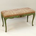 Early to mid 20th Century carved painted bench with upholstered top. Unsigned. Rubbing surface wear,