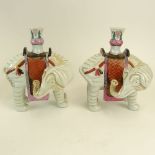 Pair Mottahedeh Chinese Style Porcelain Elephant Vases. Signed. One with loss to foot, minor paint