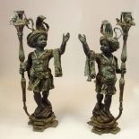 Pair 20th Century Bronze Nubian Torchieres. Unsigned. Oxidized patina. Measures 55" H x 27" W.