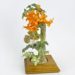 Dorothy Doughty Royal Worcester Porcelain Bird Group "Phoebe Sayor & Flame Vine". On wood stand.