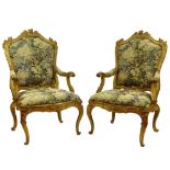Large pair of 19th Century Italian carved and gilt wood fauteuils with modern tapestry upholstery.