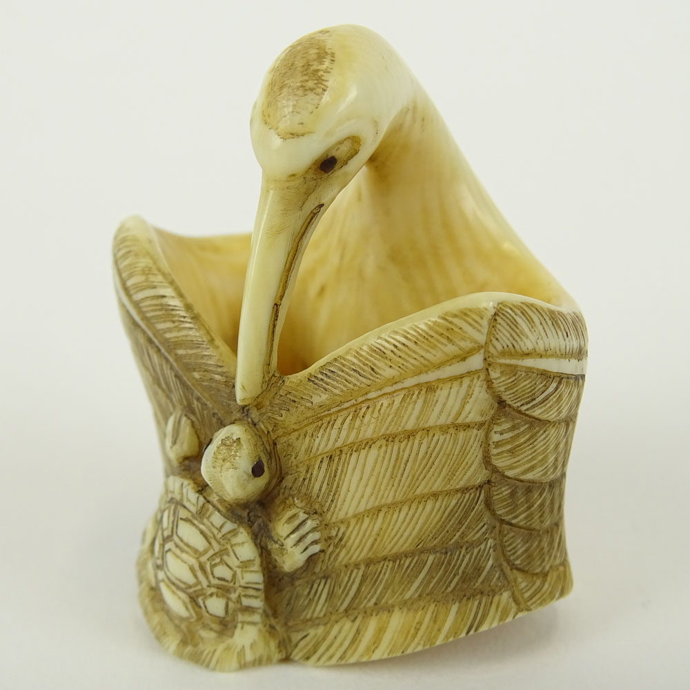 Early 20th Century Japanese Baisho Shop Carved Netsuke In The Form of a Stork and Turtle. Finely