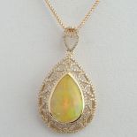 AIG Certified 9.45 Carat Pear Shape Opal, 1.27 Carat Round Cut Diamond and 14 Karat Rose Gold