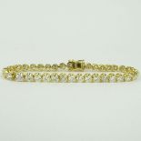 AIG Certified 11.33 Carat Round Cut Diamond and 18 Karat Yellow Gold Tennis Bracelet. Diamonds I-M