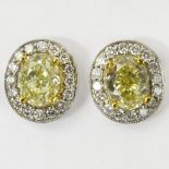 Pair of Approx. 2.05 Carat Oval Cut Fancy Yellow Diamond, .50 Carat Round Cut Diamond, 14 Karat