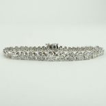 AIG Certified 9.51 Carat Round Cut Diamond and 14 Karat White Gold Tennis Bracelet. Diamonds G-I