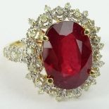 GGA Certified 7.12 Carat Oval Cut Ruby, .78 Carat Round Cut Diamond and 14 Karat Yellow Gold Ring.