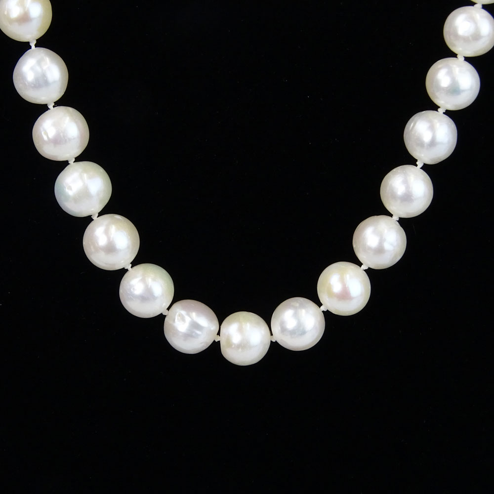 Lady's White Pearl Necklace with Diamond and 14 Karat White Gold Clasp. Pearls measure 9mm each.