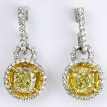 Pair of Approx. 1.40 Carat Radiant Cut Fancy Light Yellow Diamond, Platinum and Yellow Gold Earrings