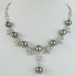 Tahitian Black Pearl, 9.48 Carat Round Cut Diamond and 14 Karat White Gold Necklace. Pearls