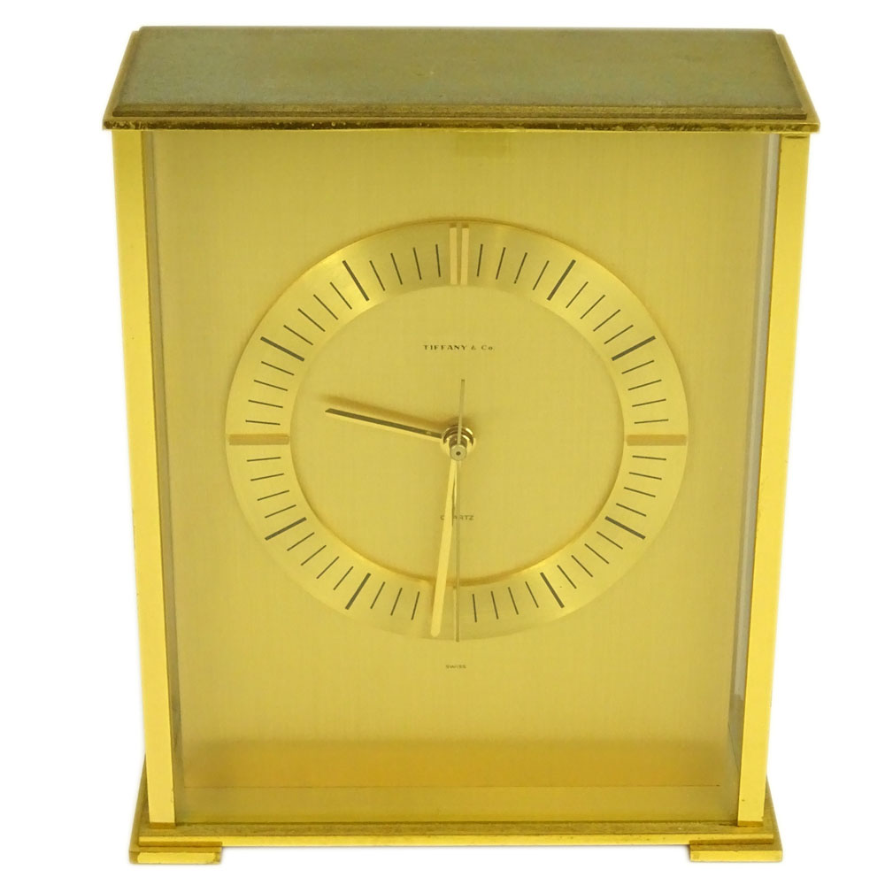 Tiffany & Co. Brass Quartz Clock. Signed Tiffany & Co. Swiss, 2048. Wear to case. Back knob needs to