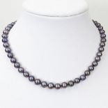 Lady's Black Pearl Necklace with Diamond and 14 Karat White Gold Clasp. Pearls measure 7-9mm each.