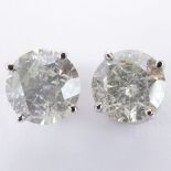 AIG Certified 2.77 Carat Total Weight Round Cut Diamond and 14 Karat White Gold Ear Studs.