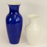 Lot of Two (20) Antique KPM Vases. One blue with white interior 15" H; the other white 11" H. Both