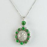 Lady's Round Cut Diamond, Jade and 18 Karat White Gold Pendant with 14 Karat White Gold Chain.