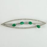 Lady's Vintage Oval Cut Emerald and 14 Karat White Gold Brooch accented throughout with Small