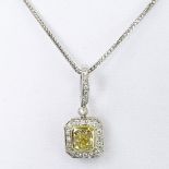 Approx. 1.25 Carat Radiant Cut Fancy Light Yellow Diamond and 18 Karat White Gold Pendant accented