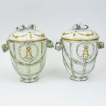 Pair of Antique KPM Porcelain Covered Urns. Signed. One with restoration to the body, the other with