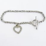 14 Karat White Gold Toggle Bracelet with Diamond Accented Heart Charm. Signed 14K. Very good