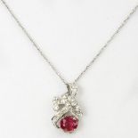 Vintage Oval Cut Ruby, Diamond and 18 Karat White Gold Pendant with 14 Karat White Gold Chain. Chain