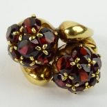 Vintage 18 Karat Yellow Gold and Garnet Cross Over Ring. Appears to be signed 750 (rubbed). Good