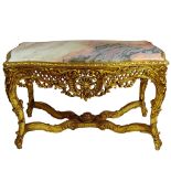 Large Rococo Style Carved and Giltwood Center Table with Marble top. Unsigned. Rubbing otherwise