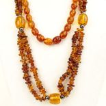 Two Vintage Chinese Amber Beaded Necklace. Unsigned. The longer measures 15" wearable length.