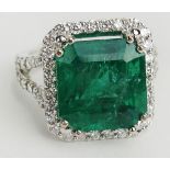 GIA Certified 9.71 Carat Octagonal Step Cut Emerald, approx. 1.21 Carat Round Cut Diamond and 18