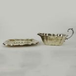 Vintage Reed & Barton Sterling Silver gravy/sauce boat and liner in the Windsor pattern. Signed.