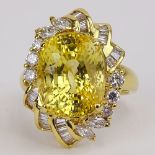 Approx. 14.07 Carat Oval Cut Sapphire, 1.05 Carat Diamond and 18 Karat Yellow Gold Ring. Diamonds