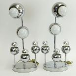 Pair Mid Century Modern Possibly Robert Sonneman Chrome lamps. Unsigned. Good condition. Measure 21"