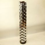 Curtis Jeré, American (20th C) Chromed metal and ebonized wood tall floor lamp. Signed. Pitting