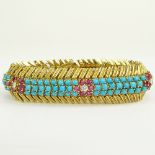 Circa 1950's 18 Karat Yellow Gold Bracelet Set with Round Cut Rubies, Diamonds and Persian