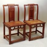 Pair of 19th C Chinese Elmwood Side Chairs. Each with a rectangular backrest, the toprail arched