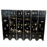 Mid-Century Chinese Black Lacquer Six Paneled Screen. The panels decorated with Chinese Ronde-