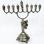 Vintage Silver Plate Menorah. Unsigned. Good vintage condition. Measures 16-1/2" H, 15" W.