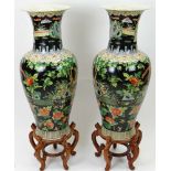 Large Pair of Chinese Famille Noir Baluster Vases with Wood Stands. Apocryphal Qianlong Mark to