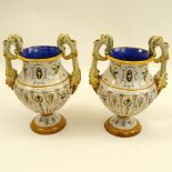 Pair of Antique Ginori Majolica Urns. Chimera handles. Signed. Measures 12-1/2" H x 8-1/2" W.