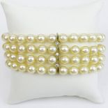 Vintage Four Strand Pearl, Diamond and 14 Karat White Gold Bracelet. Pearls measure 7mm each.