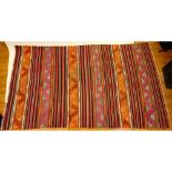 Vintage Moroccan Kilim Rug. Unsigned. Faded, wear, stains. Measures 119" x 67". Provenance: