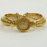 Lady's Vintage 14 Karat Yellow Gold Movado Bangle Bracelet Watch with Manual Movement. Signed Movado
