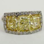 Fancy Yellow Diamond and Platinum Three Stone Ring Set with Three (3) Cushion Cut Diamonds Approx.