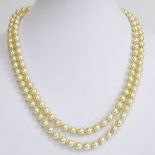 Vintage 9.00 mm White Pearl Double Strand Necklace with 14 Karat Gold and Diamond Clasp. Unsigned.