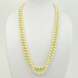 Vintage 9.50-9.60mm White Pearl Double Strand Necklace with 14 Karat Gold and Diamond Clasp. Clasp