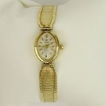 Lady's Vintage 14 Karat Yellow Gold Omega Bracelet Watch with Quartz Movement. Signed 14K. Good