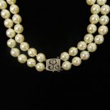 Vintage Double Strand White Pearl Necklace with 14 Karat White Gold Clasp. Pearls measure 8.5mm.