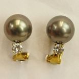 Lady's South Sea Grey Pearl, Diamond and 18 Karat Yellow Gold Earrings. Pearls mmeasure 10mm.