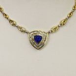 Lady's Large Gem Quality Tanzanite, Diamond and 18 Karat Gold Necklace set in the Center with a 9.27